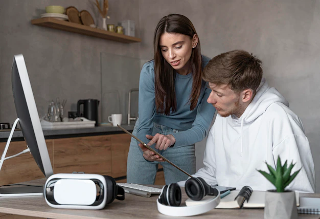 man-woman-looking-tablet-together-work_23-2148901117
